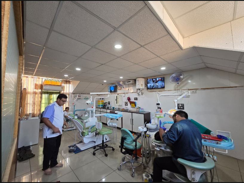 SM Dental Clinic dentist treating a patient